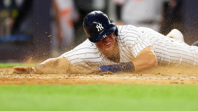 Anthony Volpe #11 of the New York Yankees scores on Kyle Higashioka #66 RBI single in the fifth inning against the Baltimore Orioles at Yankee Stadium on July 5, 2023 in the Bronx borough of New York City. 