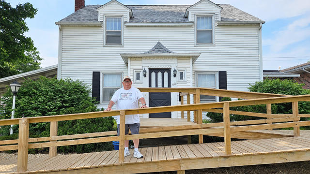Todd Noack stands in front of Rhonda's House, a respite site for mental health care in Iowa 
