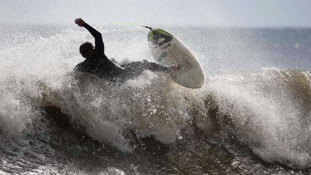 Surfers face "chaotic" waves and storm surge in hurricane season