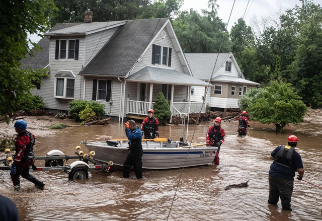 Emergency personnel with e a boat that was used to rescue residents in Stony Point, Ne wYork 