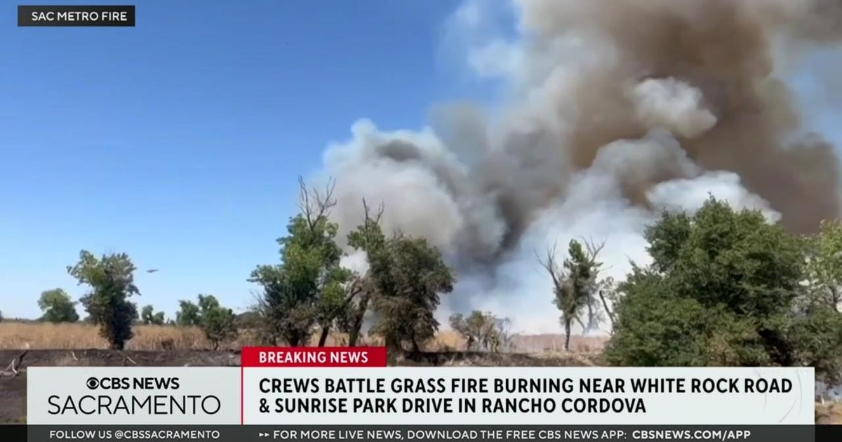 Crews battle grass fire burning near White Rock Road in Rancho Cordova