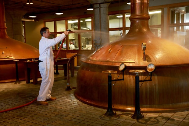 Brewer Eric Svendberg hoses brewing equipment at Anchor Brewing Co., located at 1705 Mariposa St.., in San Francisco, Calif., on Thursday, May 2, 2019.