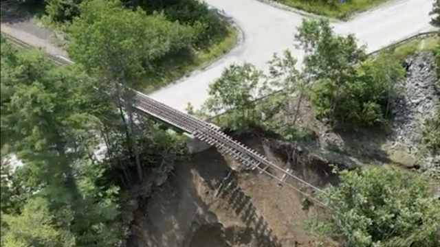 Vermont flooding leaves railroad track "dangling" in the air