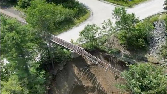 Vermont flooding leaves railroad track "dangling" in the air