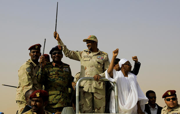 FILE PHOTO: Lieutenant General Mohamed Hamdan Dagalo greets his supporters as he arrives at a meeting in Aprag village 
