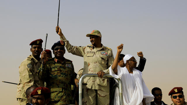 FILE PHOTO: Lieutenant General Mohamed Hamdan Dagalo greets his supporters as he arrives at a meeting in Aprag village 