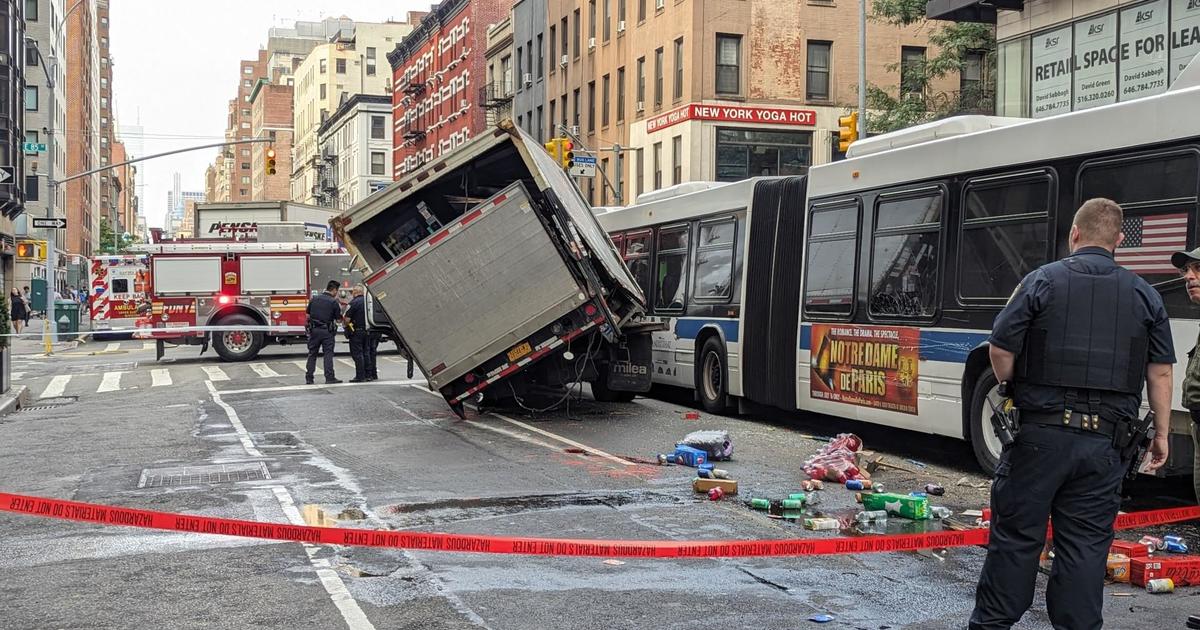 Several cars struck by MTA bus, stacked on top of each other in