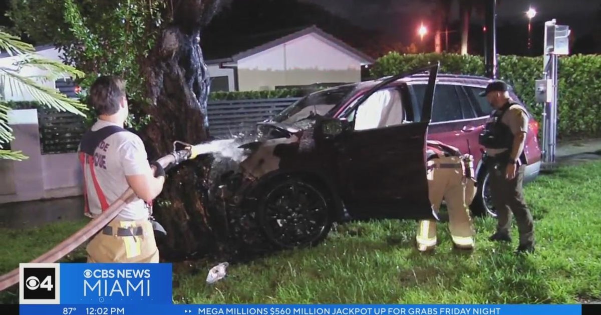 Law enforcement pull person from burning car or truck following he crashed in the vicinity of Coral Gables Law enforcement pull person from burning car or truck following he crashed in the vicinity of Coral Gables
