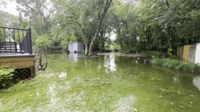 Several inches of rain flood a large backyard in Suffolk County. 