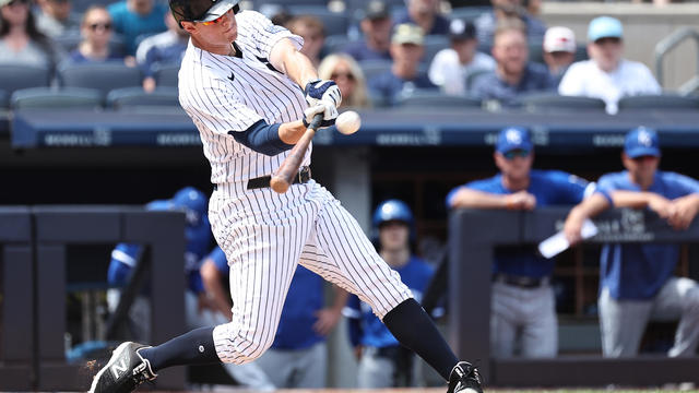 DJ LeMahieu #26 of the New York Yankees hits a home run during the seventh inning of the game against the Kansas City Royals at Yankee Stadium on July 22, 2023 in the Bronx borough of New York City. 