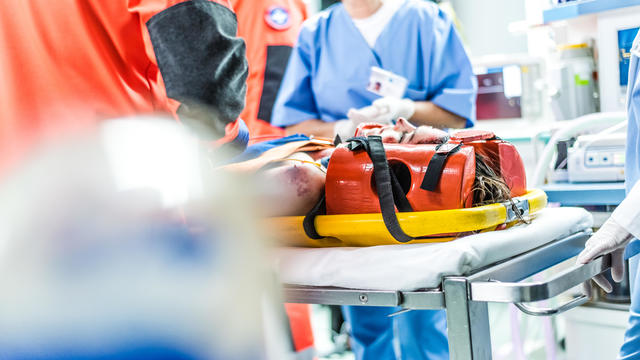 Patient immobilised on stretcher during handing over into emergency ward 