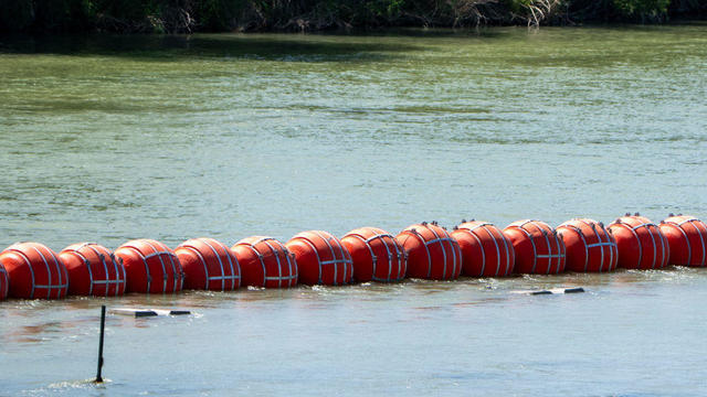 Buoys are placed on the water along the Rio Grande border with Mexico in Eagle Pass, Texas, on July 15, 2023, to prevent migrants from entering the U.S. 