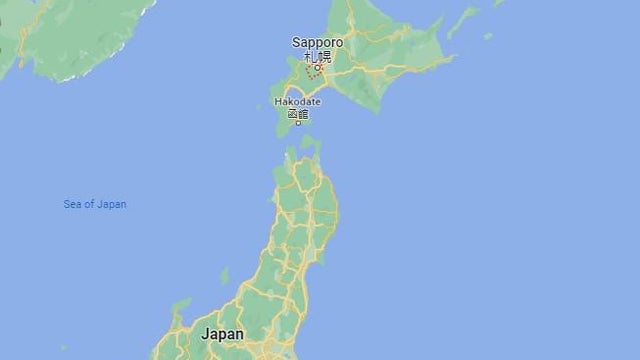 Arrests after headless body found in Japanese hotel room but man's head still missing