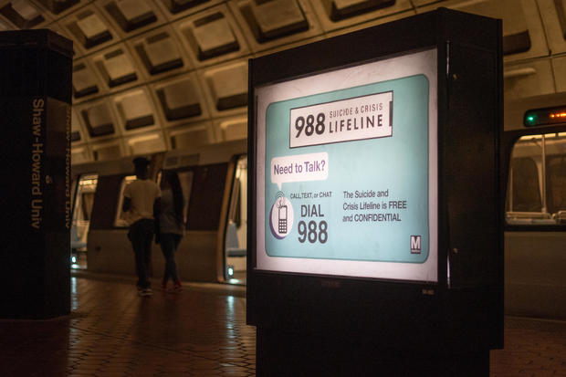 An ad for the 988 Suicide and Crisis Lifeline is seen in the Washington, D.C. Metro 