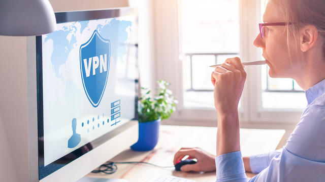 Woman sitting at computer with VPN 