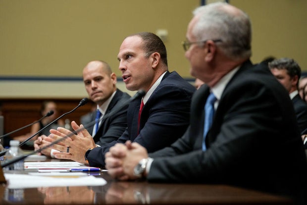 From left, Ryan Graves, David Grusch and David Fravor testify before a House subcommittee about unidentified anomalous phenomena on July 26, 2023, in Washington, D.C.