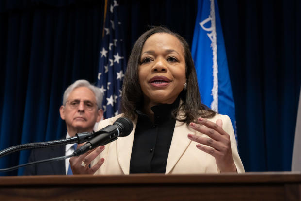 U.S. Assistant Attorney General Kristen Clarke speaks during a news conference as Attorney General Merrick Garland listens June 16, 2023, in Minneapolis. 