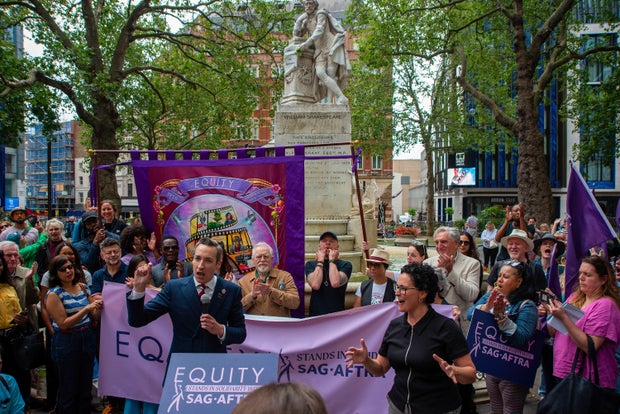 A member of the Equity speaks during a demonstration solidarity SAG WGA strikes