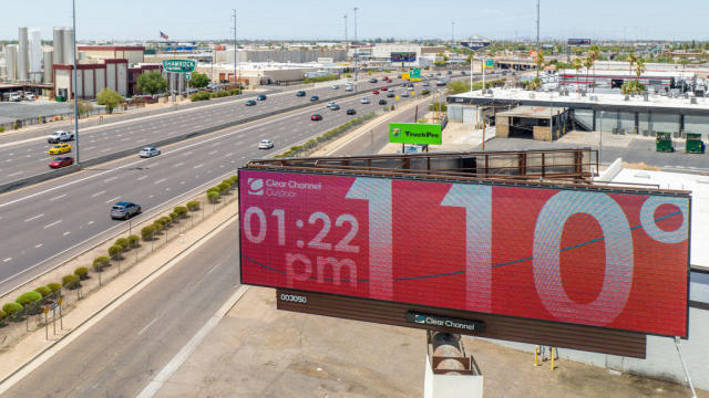 A billboard displays the temperature on July 16, 2023, in Phoenix. 