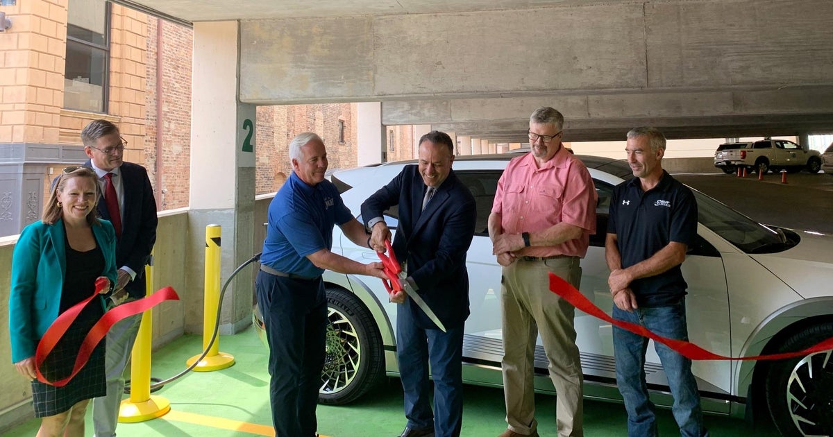 Joliet cuts ribbon on first city-owned EV charging station - CBS Chicago