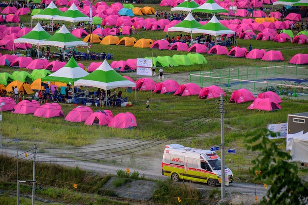 An ambulance drives out of the campsite of the World Scout Jamboree in Buan, North Jeolla province, South Korea, August 5, 2023