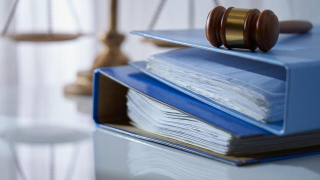 Gavel hammer on stack of document libra scale as background,Malaysia 