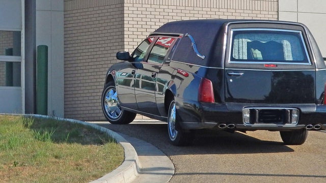 Hearse at Hospital to collect deceased patient, or corpse 