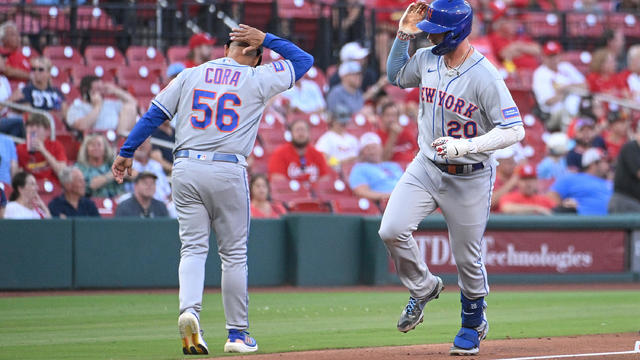 Pete Alonso #20 reacts with Third Base Coach Joey Cora #56 of the New York Mets after Alonso hits a two-run home run against the St. Louis Cardinals in the fourth inning at Busch Stadium on August 17, 2023 in St Louis, Missouri. 