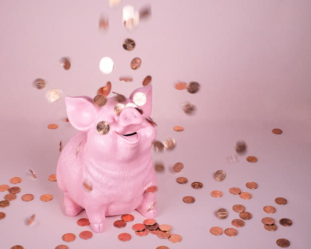 Piggy Coin Bank with falling pennies 
