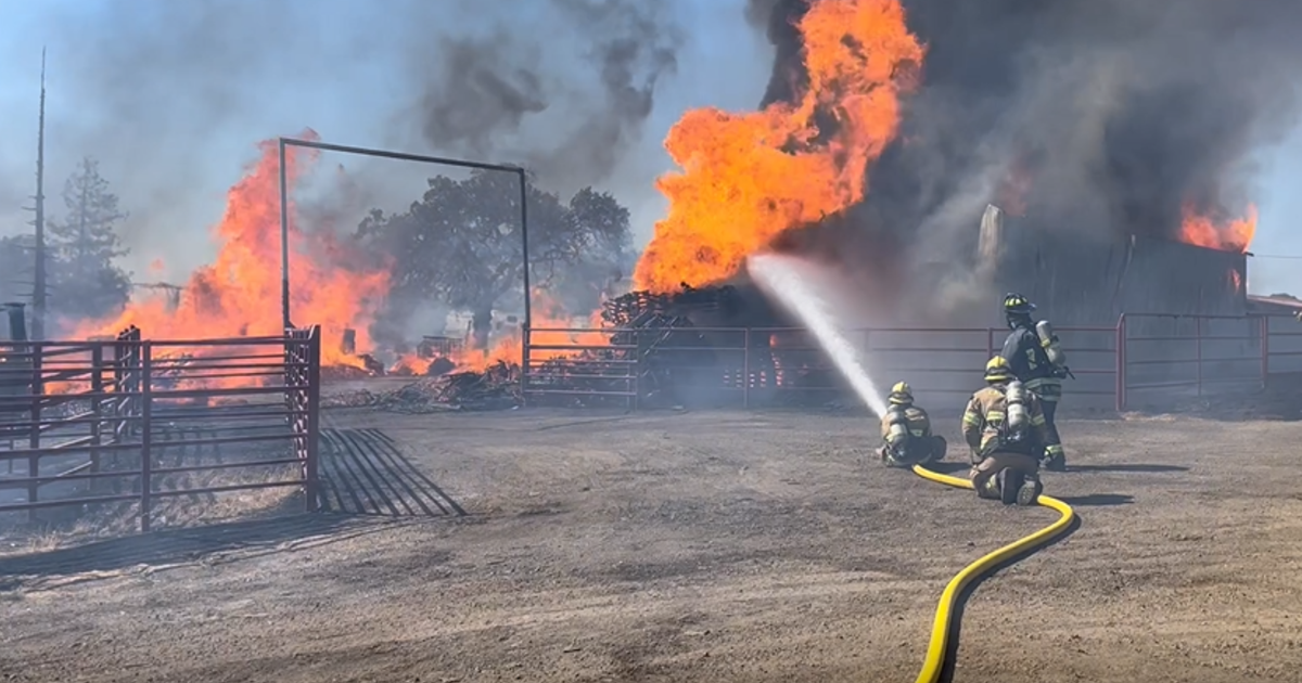 Crews battle fire at agricultural building in Jackson