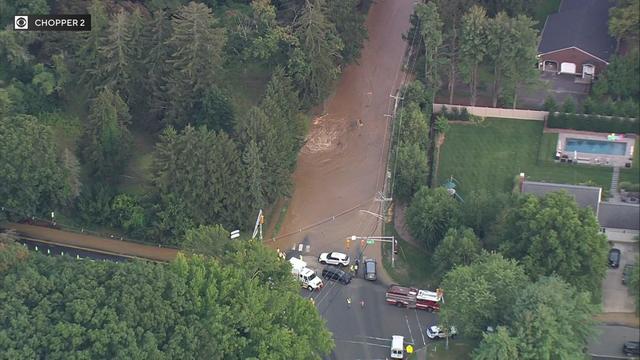 An aerial view of dirty water flooding a Middletown Township road. 