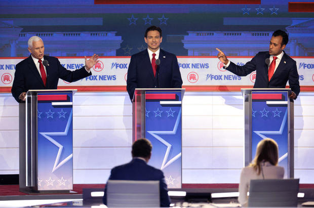 Former Vice President Mike Pence, Florida Gov. Ron DeSantis and Vivek Ramaswamy participate in the first debate of the GOP primary season hosted by Fox News at the Fiserv Forum on Aug. 23, 2023, in Milwaukee, Wisconsin. 