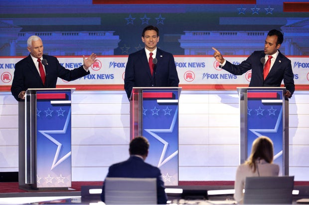 Former Vice President Mike Pence, Florida Gov. Ron DeSantis and Vivek Ramaswamy participate in the first debate of the GOP primary season hosted by Fox News at the Fiserv Forum on Aug. 23, 2023, in Milwaukee, Wisconsin.