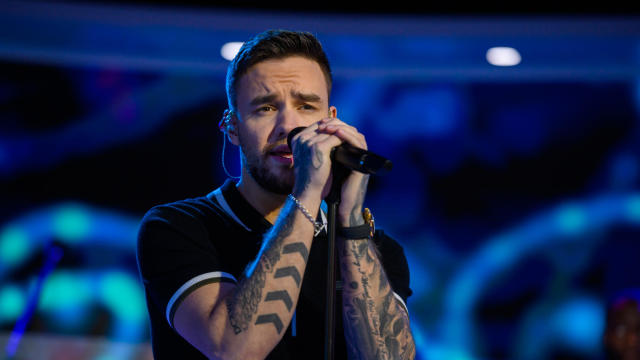 Liam Payne singing on stage 