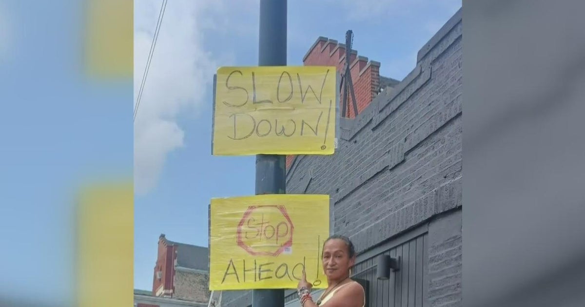 Pilsen residents post signs urging drivers to slow down at dangerous