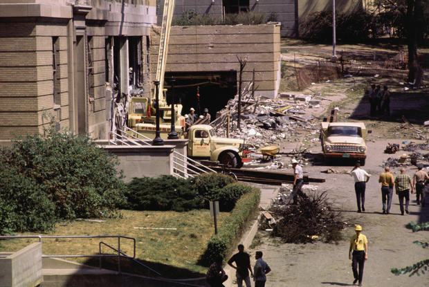 1970 photo of workmen clearing debris after bombing at University of Wisconsin 