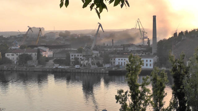 Smoke rises from the shipyard that was reportedly hit by Ukrainian missile attack in Sevastopol 