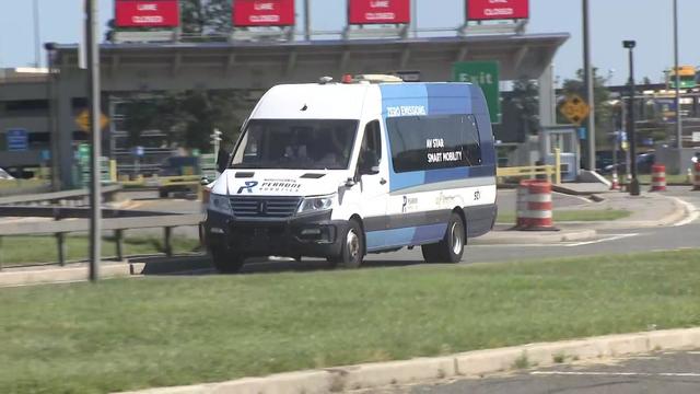 A self-driving airport shuttle van on a New Jersey road. 