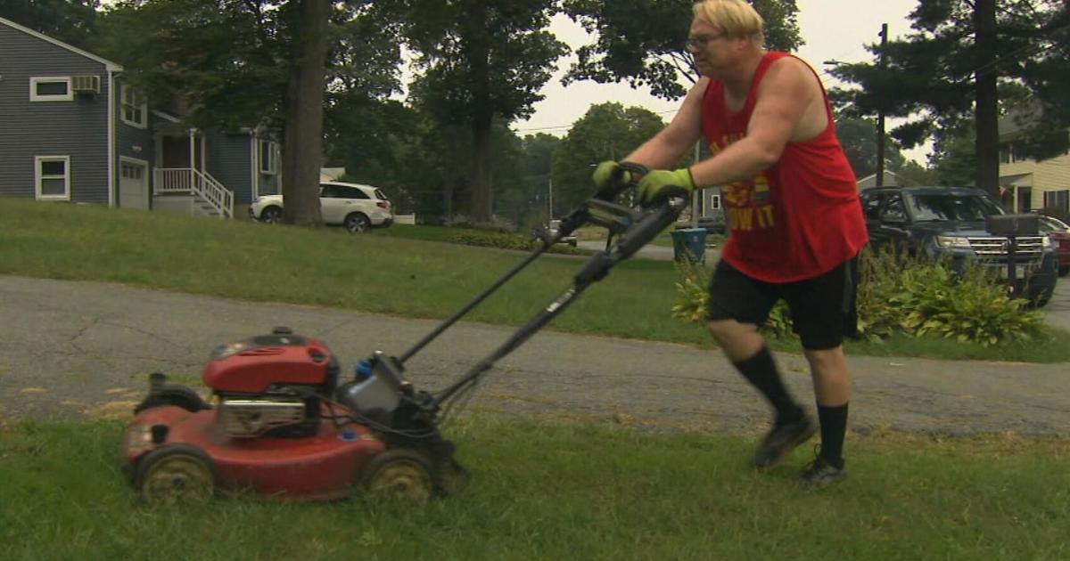 sexy man mowing the lawn