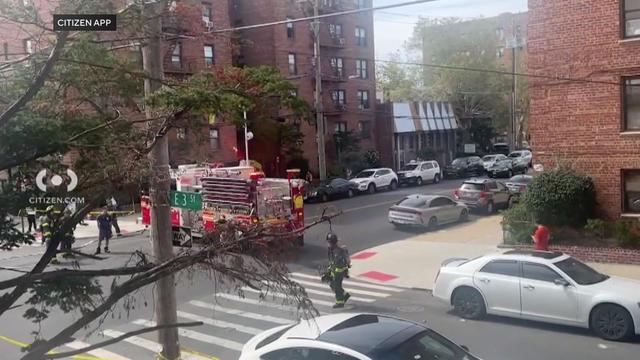 A fire truck parked outside a building in Brooklyn. 