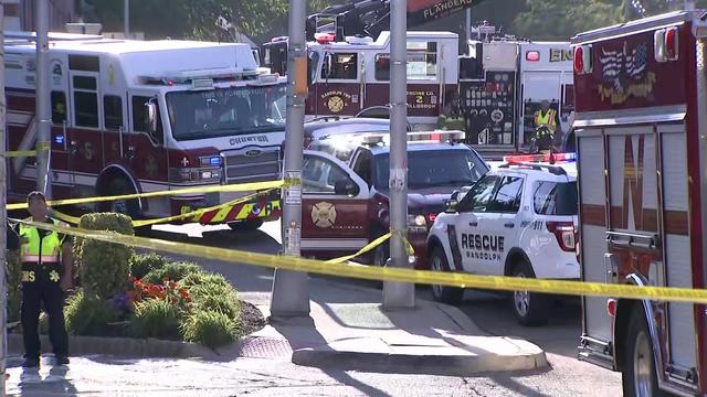 Multiple fire vehicles parked on a street. 