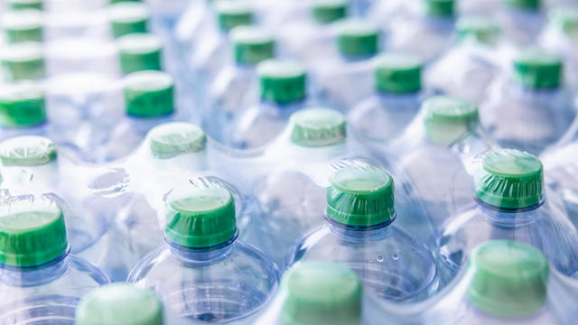 Packaging of plastic bottles with mineral water - Close up. 