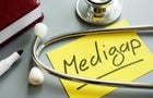Medigap or medicare supplement insurance inscription and stethoscope. 