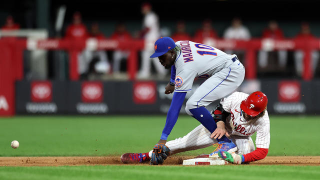 Bryce Harper #3 of the Philadelphia Phillies slides to second base past Ronny Mauricio #10 of the New York Mets during the sixth inning at Citizens Bank Park on September 22, 2023 in Philadelphia, Pennsylvania. 