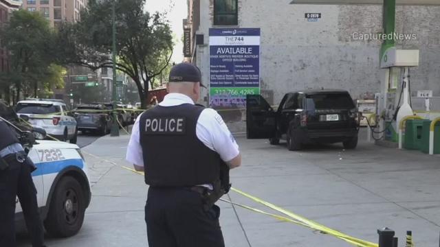 Police car with blue lights on the crime scene in traffic urban environment. 