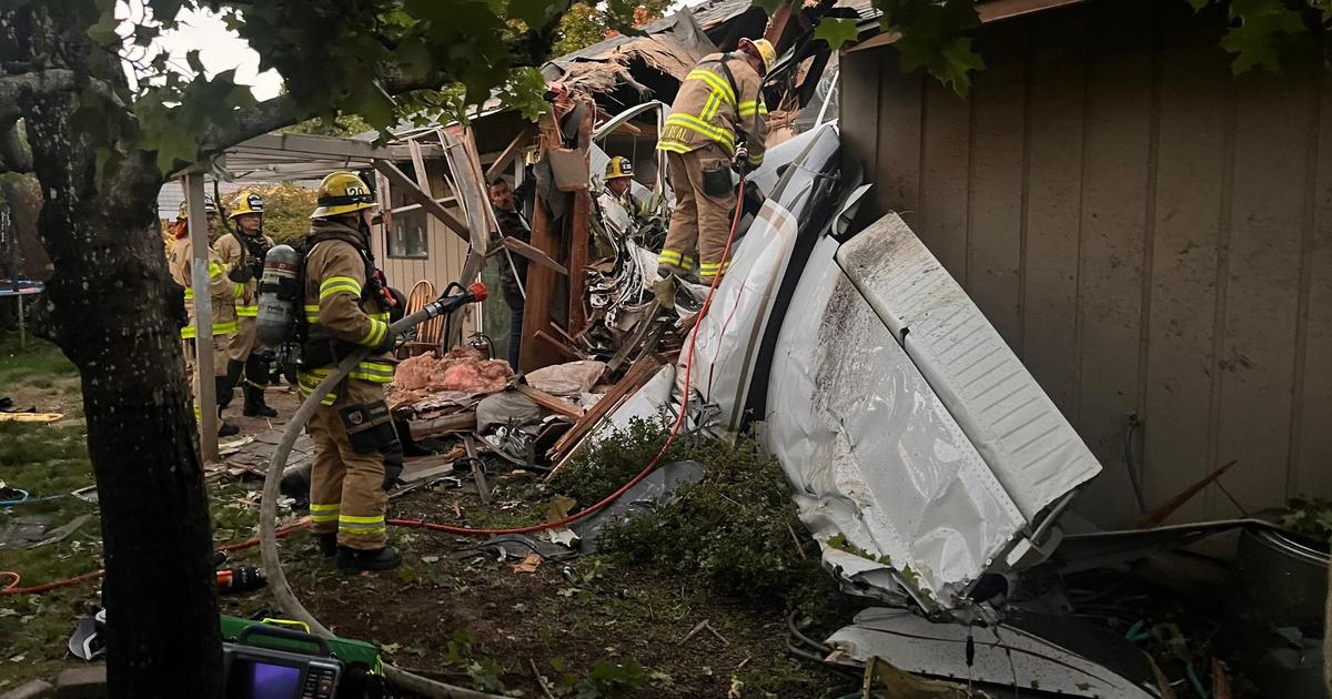Dramatic video shows plane moments before it crashed into Oregon home, killing 22-year-old instructor and 20-year-old student pilot