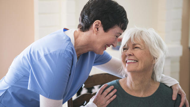 Nurse taking care of elderly lady 