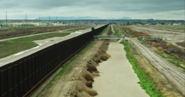 Biden says his hands are tied on border wall expansion - CBS News