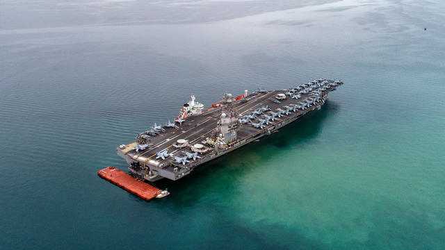 American aircraft carrier USS Gerald R. Ford is seen from the air anchored in Italy in the Gulf of Trieste on September 18, 2023. 