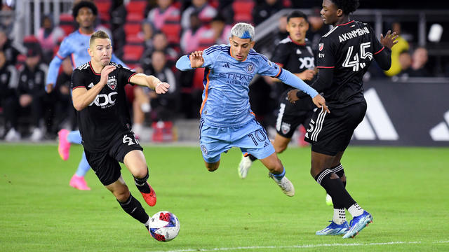 New York City FC midfielder Santiago Rodriguez (10) flies through the air after being fouled by DC United defender Matai Akinmboni (45) during the New York City FC versus D.C. United Major League Soccer (MLS) game on October 7, 2023 at Audi Field in Washi 
